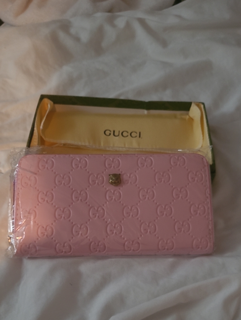 Gucci Pink Embossed GG Zip-Around Wallet with Gold Crest